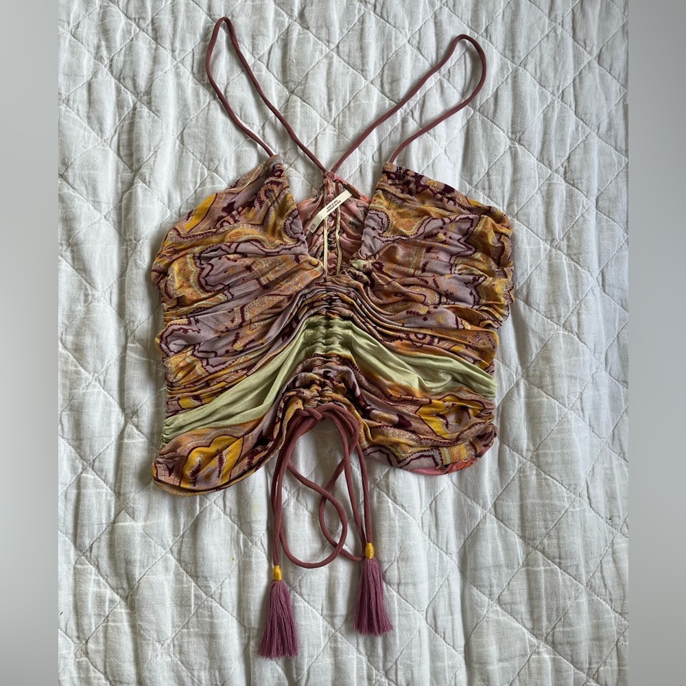 Like new Free People ruched tank top with tassels.